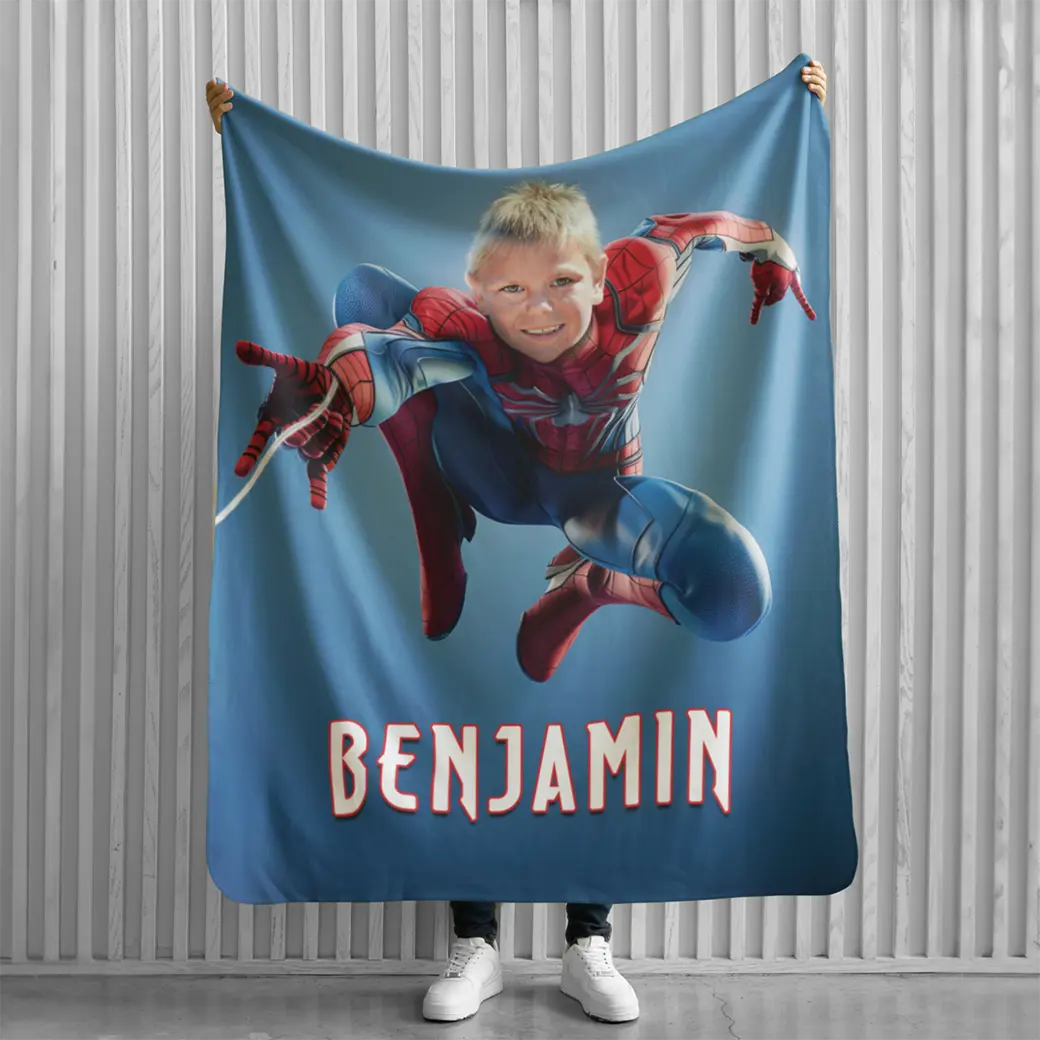 person holding personalized superhero blanket