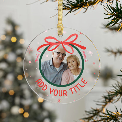 Personalized Christmas ornament with a photo of an older couple and text space for names and title, hanging on a tree.