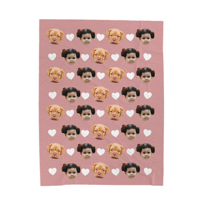 Custom face blanket of dog and child faces with hearts on a pink background
