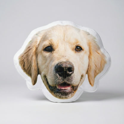 Dog-shaped pillow with a golden retriever face on a light gray background